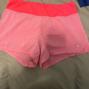 Coral workout shorts—women’s M